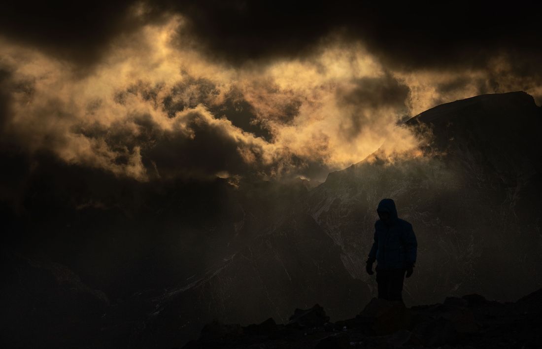 Climber under a golden sky
